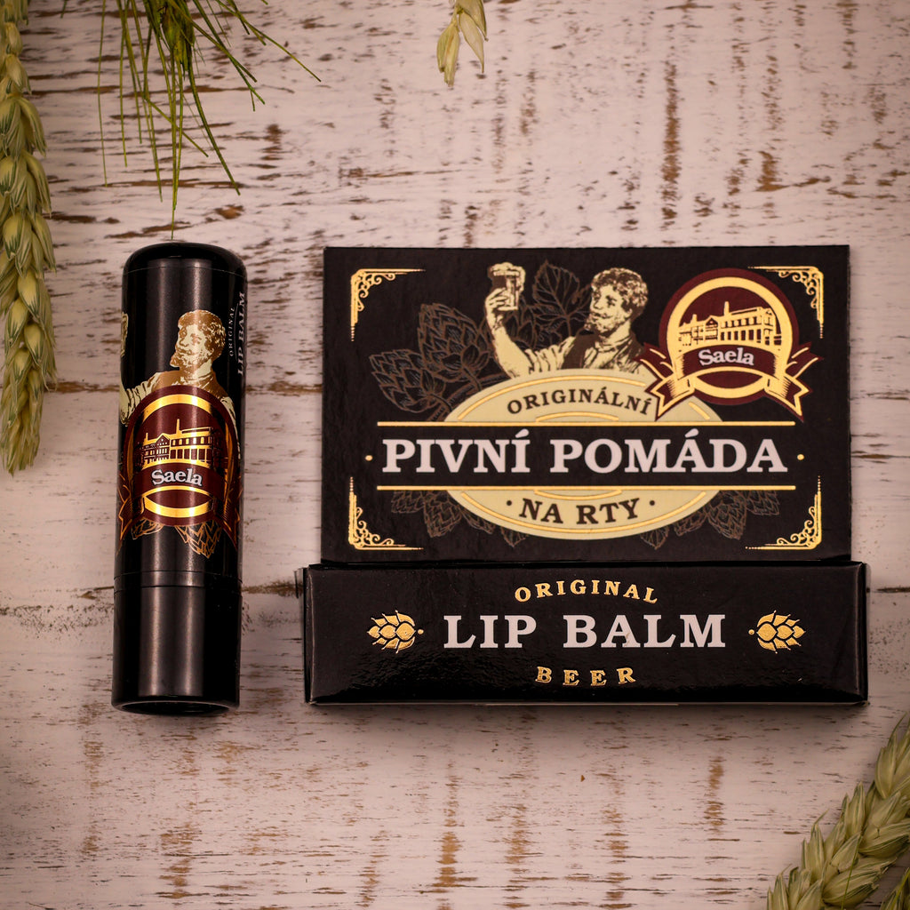 Lip balm and packaging with branding on a wooden surface