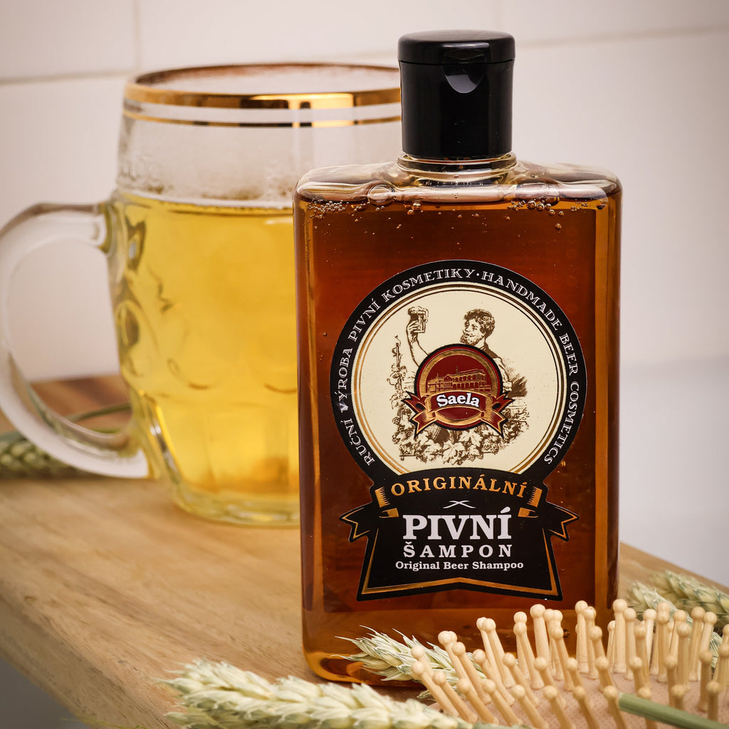 Bottle of Pivni Sampon with a glass of beer and wheat on a wooden surface.
